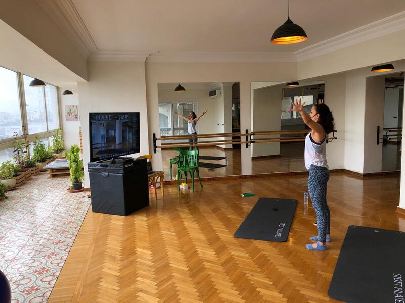 itness instructor Sarah Helmy leading a workout on the video conference application Zoom at her Nile-side studio in Cairo. Photo by Abu Bakr Shaaban