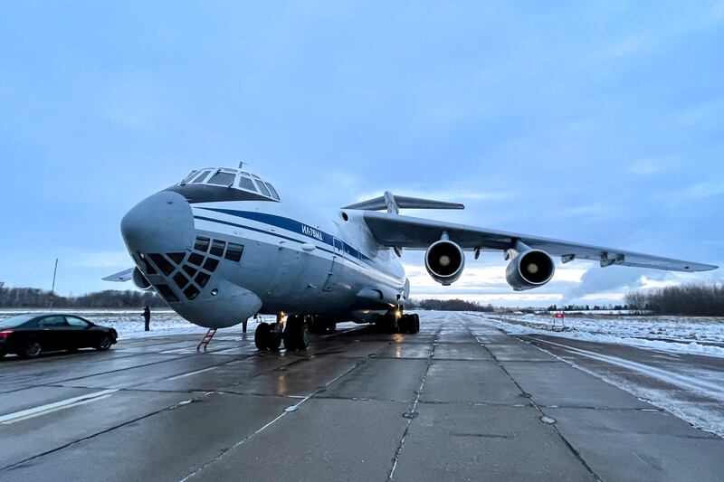 A Russian military plane with Belarusian troops on board waits to take off from an airfield outside Minsk, Belarus, to fly to Kazakhstan. AP