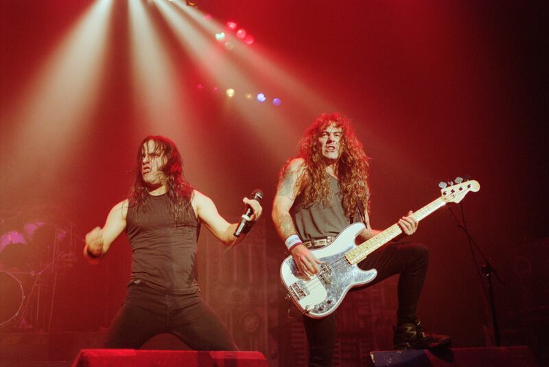 Iron Maiden singer Blaze Bayley, left, and bass guitarist Steve Harris at Brixton Academy, London, in 1995. Getty Images
