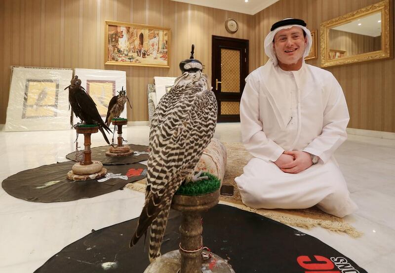 The falconer and Nabadi poet Salem Al Dhabari at home in Abu Dhabi with his hunting falcons. Ravindranath K / The National