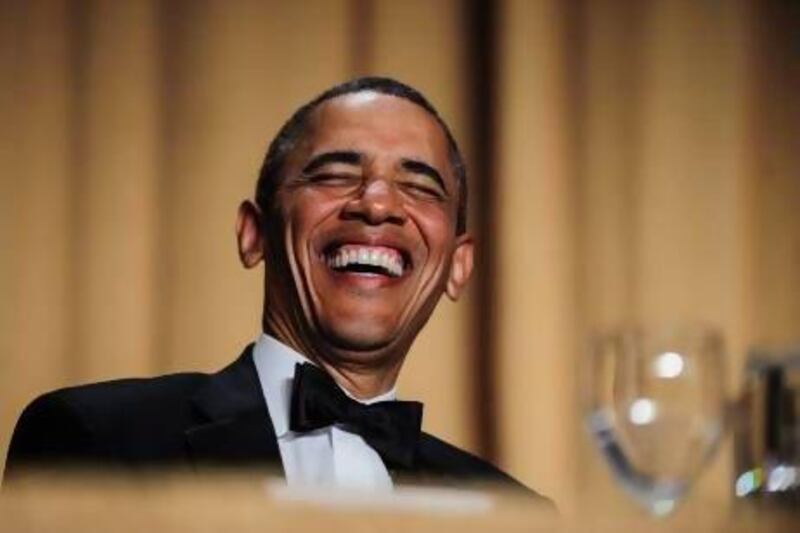 US president Barack Obama reacts to a joke told by comedian Conan O'Brien during the White House Correspondents' Association dinner in Washington.