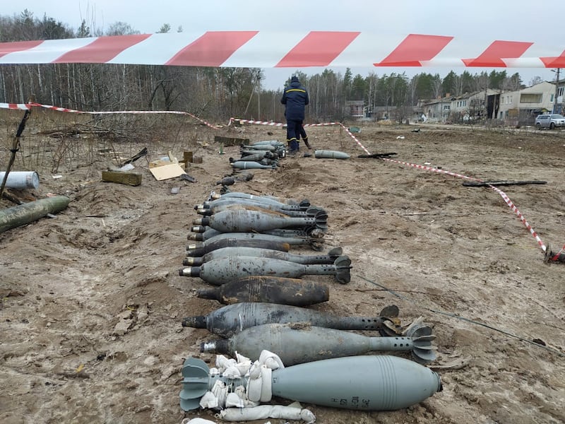 State emergency servicemen clear shells near Chernigiv, northern Ukraine. AFP