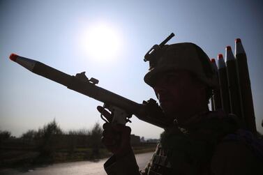 An Afghan security official stands guard at a checkpoint on the outskirts of Jalalabad, Afghanistan, in December 2019. EPA