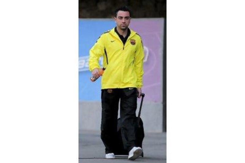 Xavi, the Barca midfielder, arrives in London.