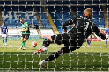 Leicester City's Danish goalkeeper Kasper Schmeichel (R) jumps and saves a penalty hit by Brighton's French striker Neal Maupay (L) during the English Premier League football match between Leicester City and Brighton and Hove Albion at the King Power Stadium in Leicester, central England, on June 23, 2020. RESTRICTED TO EDITORIAL USE. No use with unauthorized audio, video, data, fixture lists, club/league logos or 'live' services. Online in-match use limited to 120 images. An additional 40 images may be used in extra time. No video emulation. Social media in-match use limited to 120 images. An additional 40 images may be used in extra time. No use in betting publications, games or single club/league/player publications. / AFP / POOL / ANDREW BOYERS / RESTRICTED TO EDITORIAL USE. No use with unauthorized audio, video, data, fixture lists, club/league logos or 'live' services. Online in-match use limited to 120 images. An additional 40 images may be used in extra time. No video emulation. Social media in-match use limited to 120 images. An additional 40 images may be used in extra time. No use in betting publications, games or single club/league/player publications.