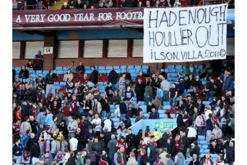 Aston Villa fans display a banner criticising Gerard Houllier at the weekend. Paul Childs / Action Images