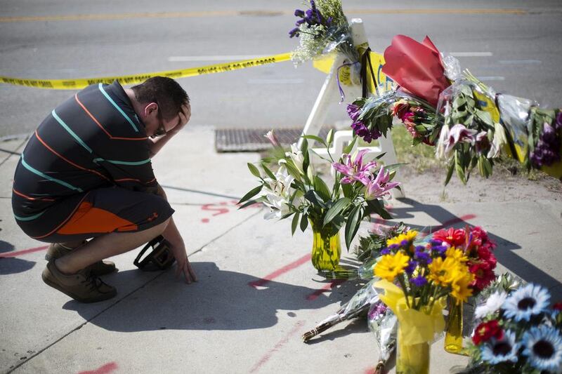 A Charleston resident grieves near the church where a gunman killed nine people. David Goldman / AP Photo