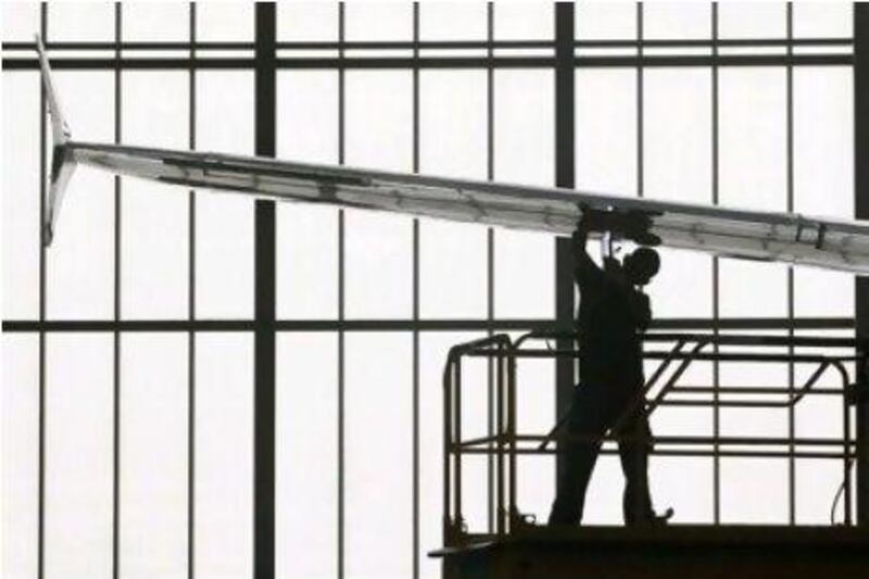 The Middle East subsidiary of Airbus aims to sell as much as 100 aircraft this year. Above, a worker inspects an A320 being built in Tianjin, China.