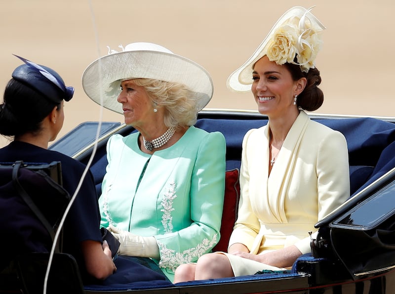 Camilla, left, and Kate, who is wearing the pearl earrings, take part in the Trooping the Colour in June 2019. Reuters 