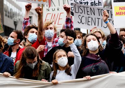 Fridays for Future climate activists throng around Swedish campaigner Greta Thunberg as she visits Berlin. EPA 
