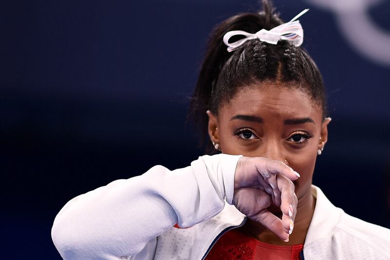 USA's Simone Biles gestures during the artistic gymnastics women's team final during the Tokyo 2020 Olympic Games at the Ariake Gymnastics Centre in Tokyo on July 27, 2021.  Biles withdrew from another Olympic final on Sunday.