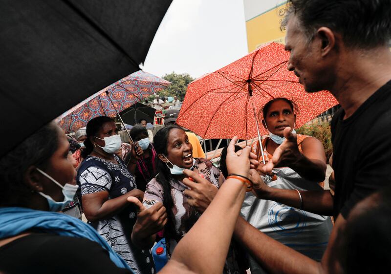 A dispute arises as people start queue jumping at a fuel station in Colombo, Sri Lanka as they wait to buy kerosene oil amid a shortage of domestic gas. Reuters