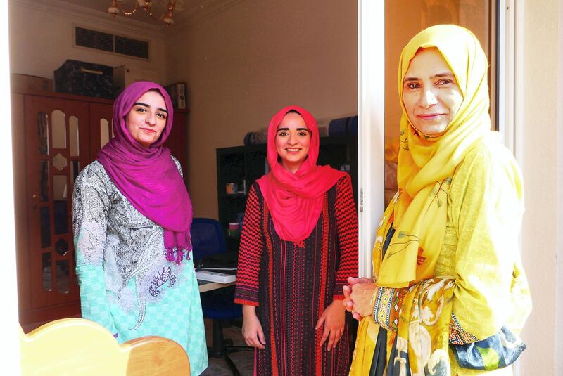Najma with her daughters Neha Mohammed Tahir (center) and Jawahir Mohammed Tahir (left) at her home in Dubai on June 5 , 2021. During the isolation of her daughters, she used to check on them from the home balcony.  Pawan Singh / The National. 
