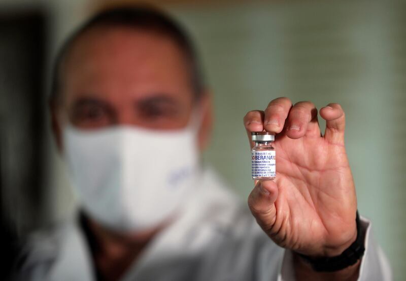 epa09036425 The Director of the Finlay Vaccine Institute Vicente Verez shows the Cuban vaccine Soberana 02, in Havana, Cuba, 25 February 2021. The Cuban vaccine candidates against the coronavirus 'Soberana 02' and 'Abdala' will be the first in Latin America to start the third and final phase of clinical trials to evaluate their efficacy against the disease.  EPA-EFE/Ernesto Mastrascusa