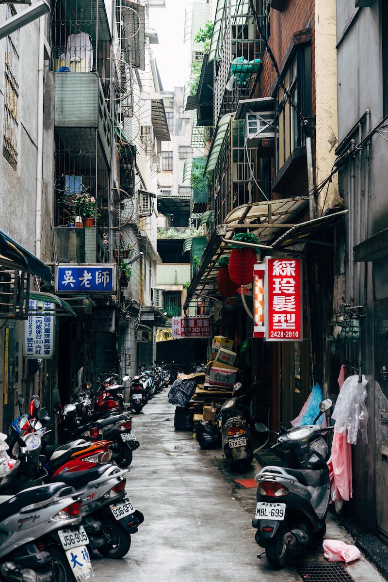Narrow streets such as this one in Taiwan mean buildings shield each other from the full force of the sun. Photo: Unsplash
