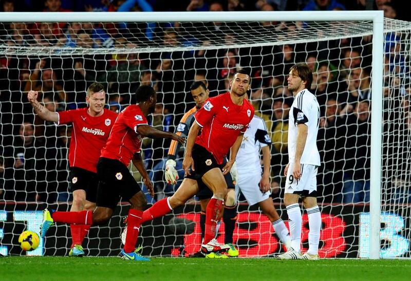 It's despair for Swansea City as Steven Caulker of Cardiff City, second from right, celebrates scoring the only goal of their Premier League match.  Laurence Griffiths / Getty Images