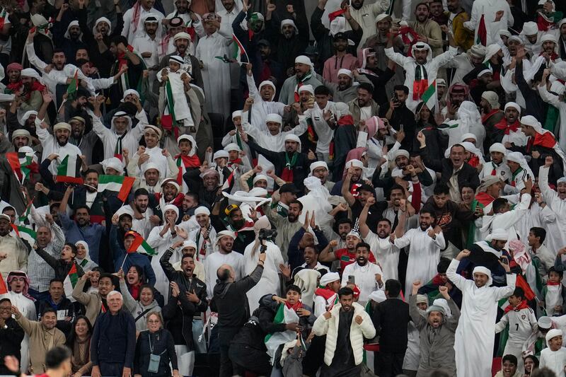 UAE supporters celebrate after Khalifa Al Hammadi's equaliser. AP 