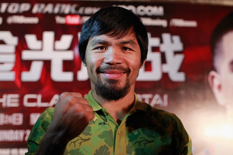 SHANGHAI, CHINA - JULY 31:  Manny Pacquiao speaks during a press conference on July 31, 2013 in Shanghai, China.  (Photo by Kevin Lee/Getty Images) *** Local Caption ***  175071970.jpg