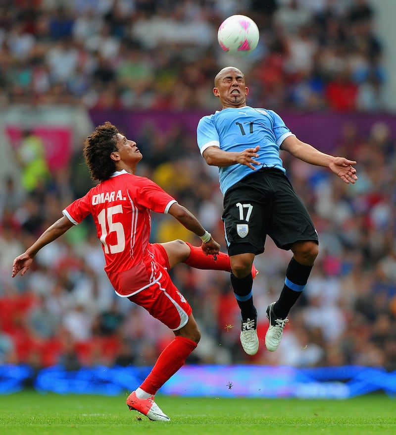 MANCHESTER, ENGLAND - JULY 26: Omar Abdulrahman of the UAE in action with Egidio Arevalo during the Men's Football first round Group A Match of the London 2012 Olympic Games between United Arab Emirates  and Uruguay, at Old Trafford on July 26, 2012 in Manchester, England.  (Photo by Michael Regan/Getty Images)