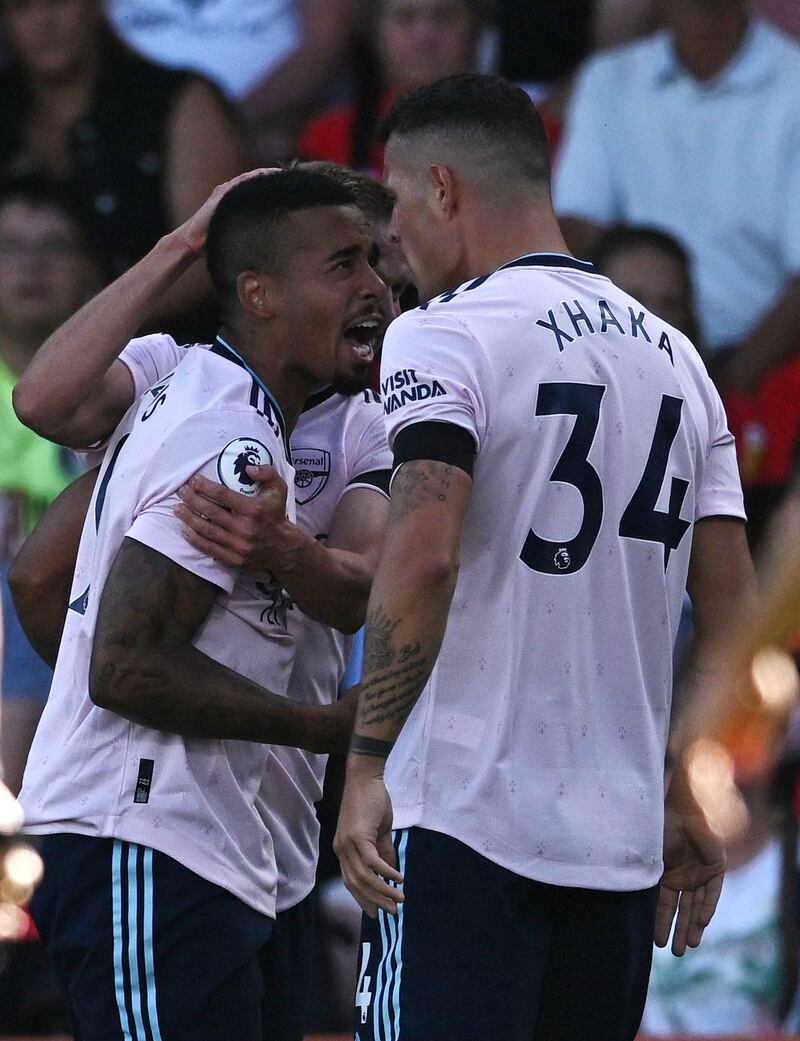 Gabriel Jesus and Granit Xhaka celebrate after Martin Odegaard scores their first goal. Reuters