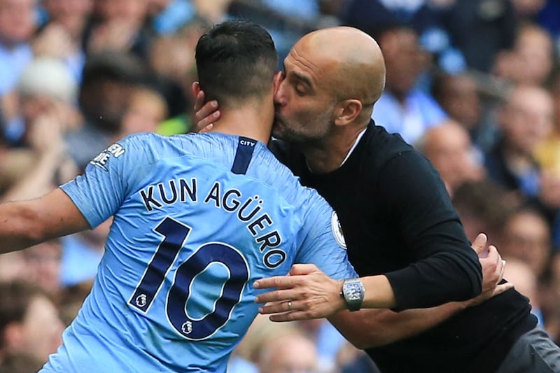 Manchester City manager Pep Guardiola kisses Sergio Aguero as the Argentine is substituted just after completing his hat-trick during the Premier League match at home to Huddersfield Town in August, 2019. Reuters