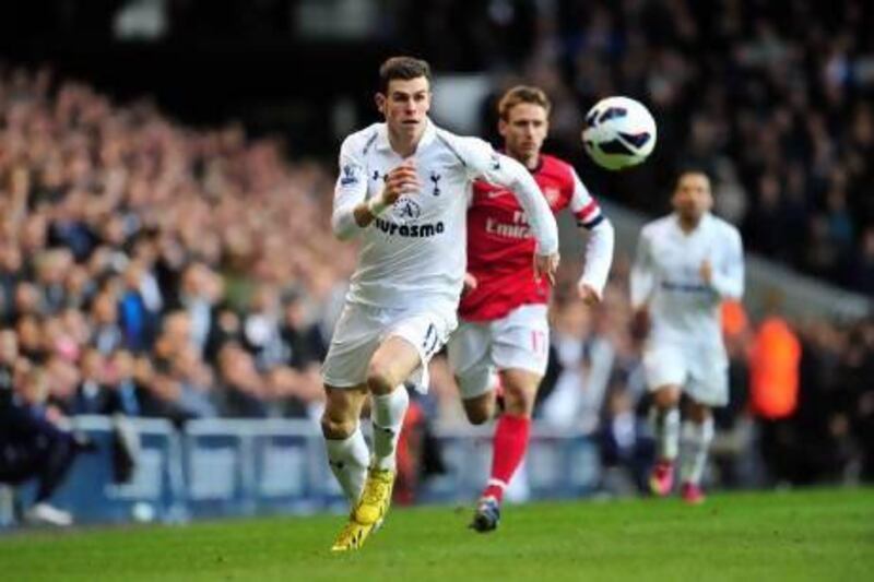 Gareth Bale, left, scored his 16th league goal of the season against Arsenal yesterday. Glyn Kirk / AFP