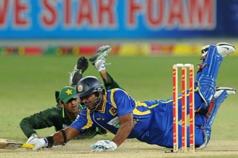 Sri Lanka’s Kumar Sangakkara, right, is run out on 45 against Pakistan in Dubai last night.