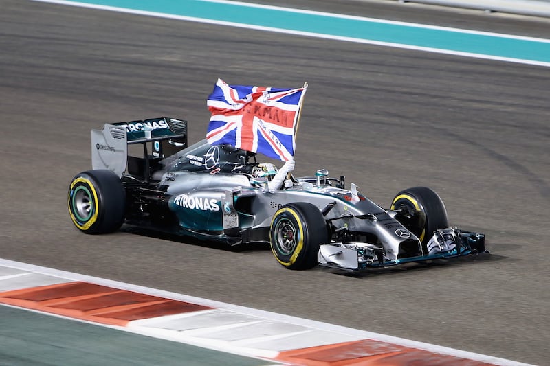Hamilton celebrates after winning the World Championship at the Abu Dhabi Grand Prix at Yas Marina Circuit on November 23, 2014. Getty Images