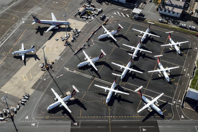 SYDNEY, AUSTRALIA - APRIL 22: Qantas planes are parked on the tarmac at Sydney Airport on April 22, 2020 in Sydney, Australia. Restrictions have been placed on all non-essential business and strict social distancing rules are in place across Australia in response to the COVID-19 pandemic.  (Photo by Cameron Spencer/Getty Images)