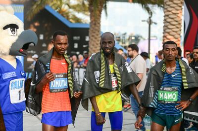 Kenyan Timothy Kiplagat, centre, won the men's Adnoc Abu Dhabi Marathon. Khushnum Bhandari / The National