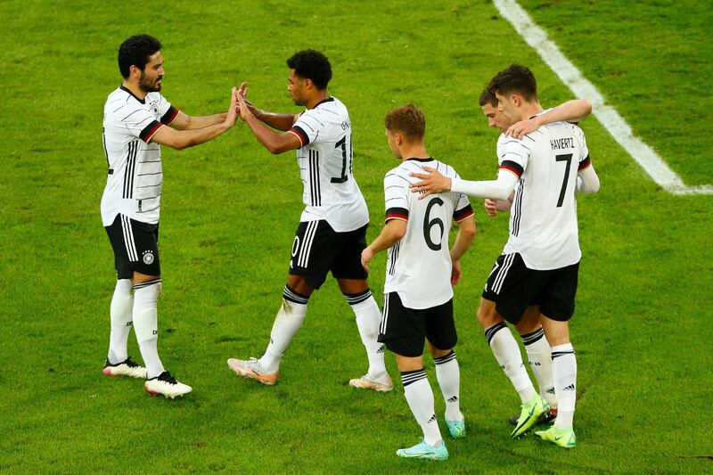 Germany's midfielder Kai Havertz, right, celebrates the fourth goal against Latvia in Duesseldorf. AFP