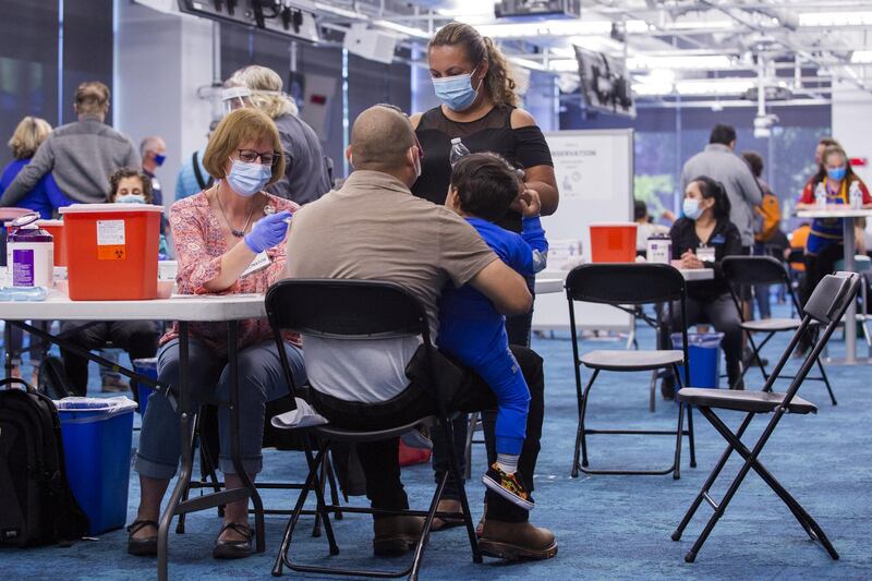 A healthcare worker administers a dose of the Johnson & Johnson Janssen Covid-19 Covid-19 vaccine at the Facebook Inc. headquarters in Menlo Park, California, U.S., on Saturday, April 10, 2021. Facebook converted part of its headquarters into a vaccination clinic for under-served communities. Photographer: Nina Riggio/Bloomberg