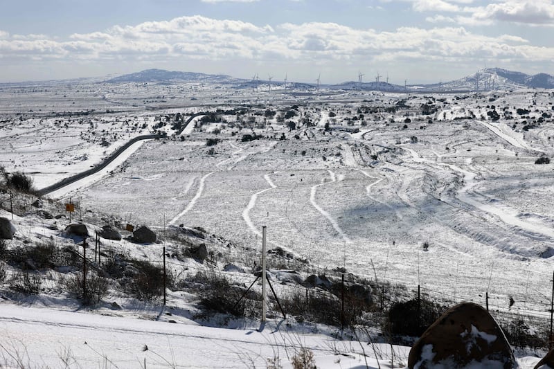 Israel's border with Syria is covered with snow, near the Druze town of Masada. AFP