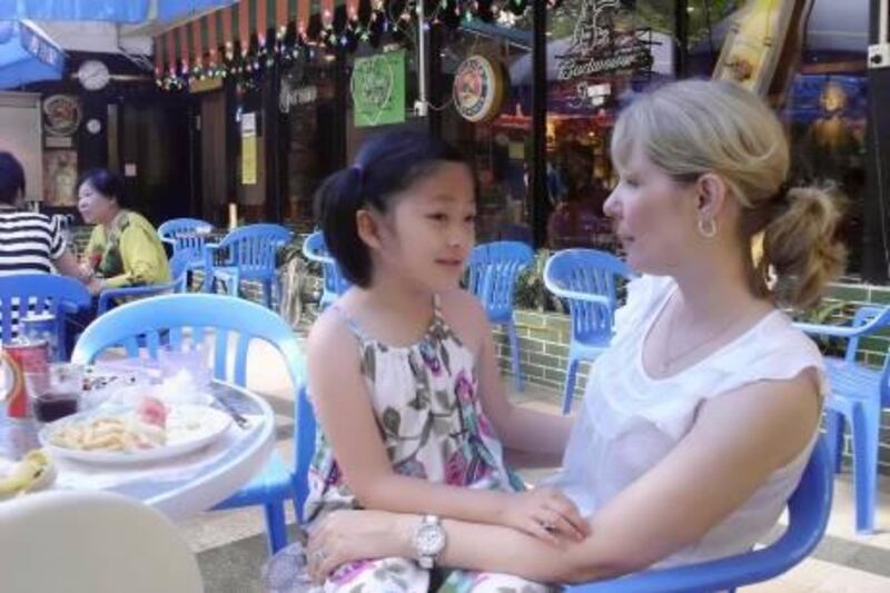 Kris Vanderweele, 42, from Michigan, with her daughter Kate, eight, who was adopted from China seven years ago. Daniel Bardsley /The National 