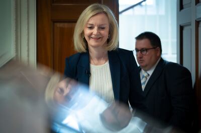 Liz Truss has defended her decisions and blamed institutions including the Bank of England for their failure. PA via AP
