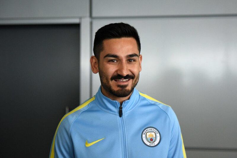 Manchester City’s German midfielder Ilkay Gundogan arrives to meet members of the media at the City Football Academy in Manchester, north west England on July 3, 2016. Oli Scarff / AFP