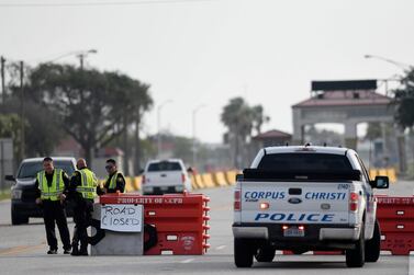 Police officers guard a checkpoint after a shooting incident at Corpus Christi Naval Air Station, Texas, on Thursday. USA Today Network via Reuters