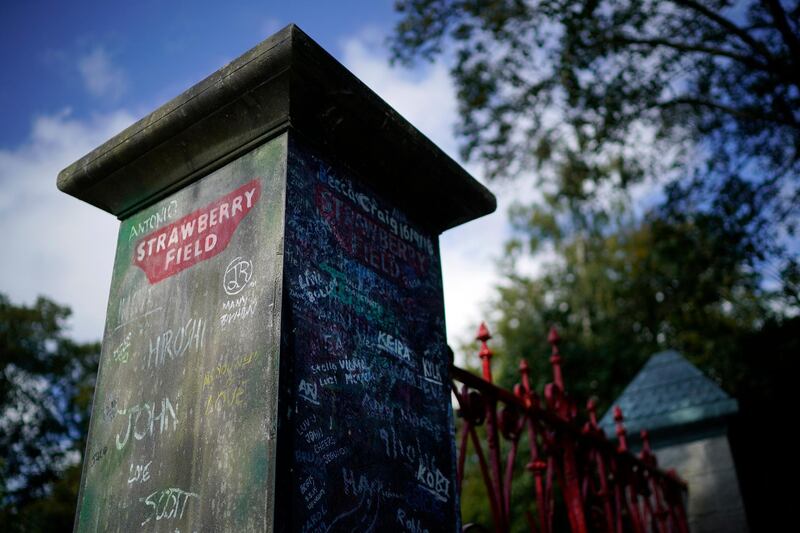 The original iron gates to Strawberry Field are displayed to visitors before they are relocated in the garden of Strawberry Field.
