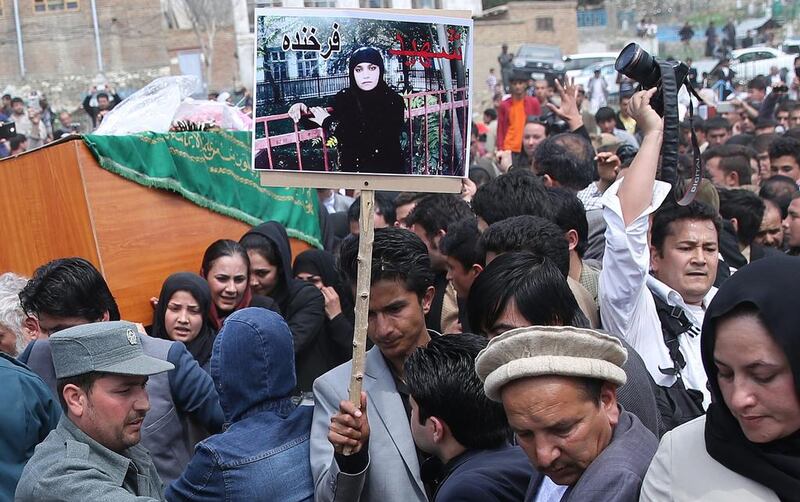 Afghan women carry the coffin of Farkhunda through downtown Kabul, Afghanistan on March 2015, during her burial ceremony. An Afghan court has overturned the death sentences for four men convicted of taking part in the mob killing outside a Kabul shrine. Massoud Hossaini / Associated Press