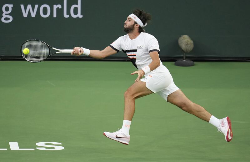 Nikoloz Basilashvili of Georgia hits a return to Cameron Norrie of Great Britain. EPA