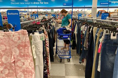 Earnings reports from Walmart, Target and Amazon showed higher costs are hurting retailers' operations. AP