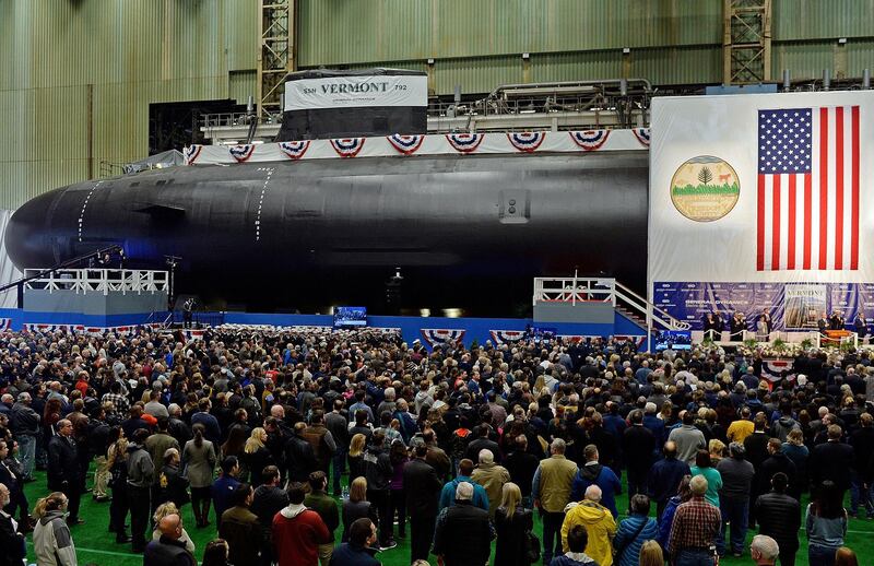 Guests gather in the main assembly building for the christening of the Navy's newest nuclear-powered attack submarine, USS Vermont on Saturday, Oct. 20, 2018 at General Dynamics Electric Boat in Groton, Conn. Vermont is the 19th vessel in the Virginia class of submarines, which are equipped with torpedoes and missiles and designed to carry out a wide range of missions, including surveillance work and the delivery of Special Operations forces.  (Sean D. Elliot/The Day via AP)