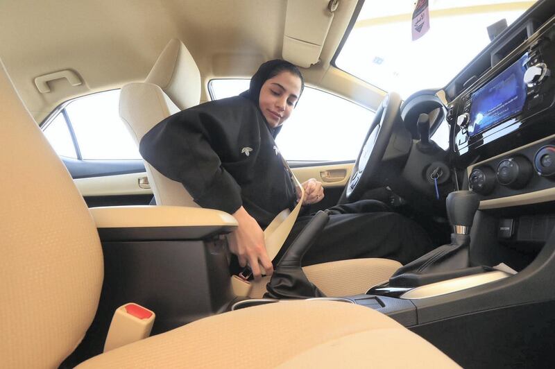 A Saudi woman buckles up before a driving test at the General Department of Traffic in the Saudi capital of Riyadh. CIC / Ministry of Media