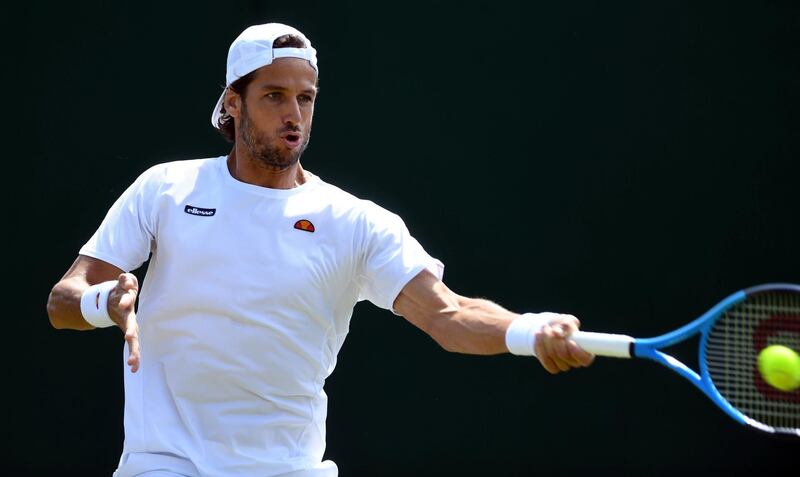 epa06860533 Feliciano Lopez of Spain returns to Federico Delbonis of Argentina in their first round match during the Wimbledon Championships at the All England Lawn Tennis Club, in London, Britain, 03 July 2018. EPA/GERRY PENNY EDITORIAL USE ONLY/NO COMMERCIAL SALES