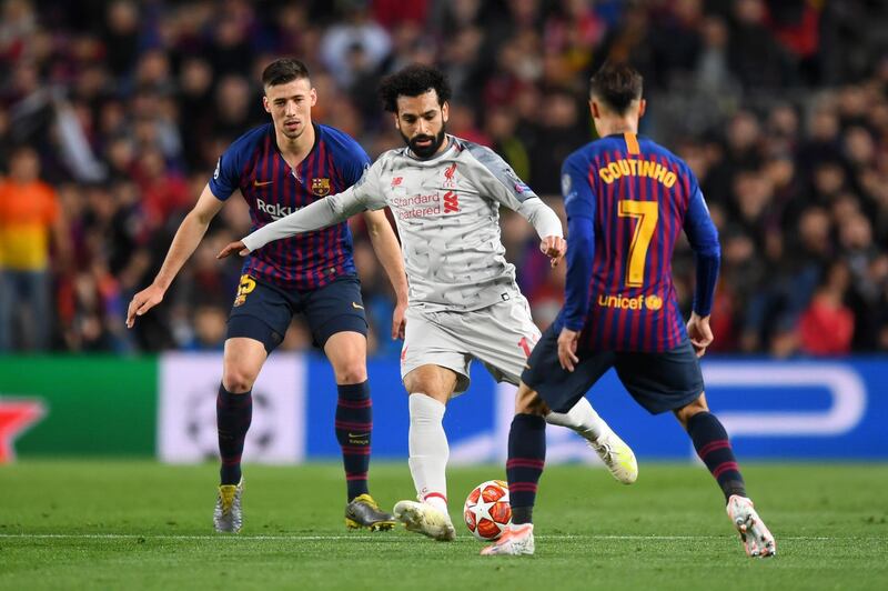 BARCELONA, SPAIN - MAY 01:   Mohamed Salah of Liverpool controls the ball as Clement Lenglet of Barcelona and Philippe Coutinho of Barcelona look on during the UEFA Champions League Semi Final first leg match between Barcelona and Liverpool at the Nou Camp on May 01, 2019 in Barcelona, Spain. (Photo by Michael Regan/Getty Images)