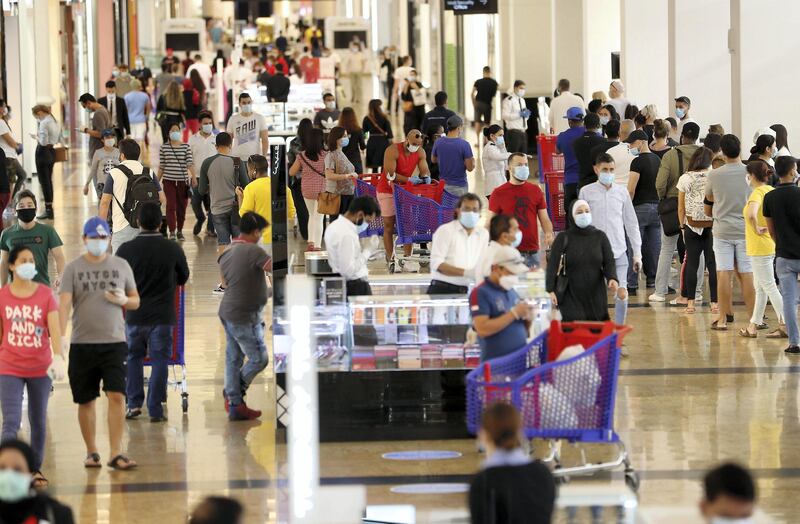 DUBAI, UNITED ARAB EMIRATES , April 29 – 2020 :- Shoppers wearing protective face mask to prevent the spread of the coronavirus at Mall of the Emirates in Dubai. Authorities ease the restriction for the residents in Dubai. At present mall opening timing is 12:00 pm to 10:00 pm. Carrefour timing is 9:00 am to 10:00 pm. (Pawan Singh / The National) For News/Standalone/Online. Story by Patrick