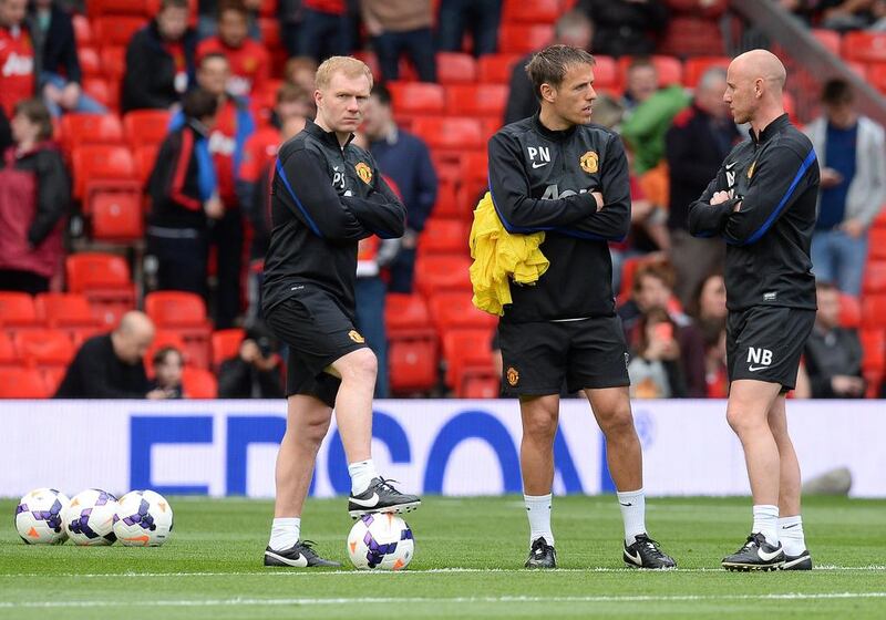Giggs has got the 'Class of '92' together in Paul Scholes, left, Phil Neville, centre, and Nicky Butt to be in his backroom staff. Andrew Yates / AFP