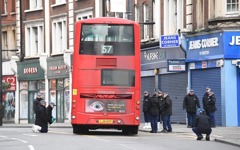 epa08190200 Police activity inside a cordon where a man has been shot by armed police at a street in Streatham, London, Britain, 03 February 2020. A man has been shot by police in a terrorist-related incident on 01 February. Two people have been stabbed.  EPA/FACUNDO ARRIZABALAGA