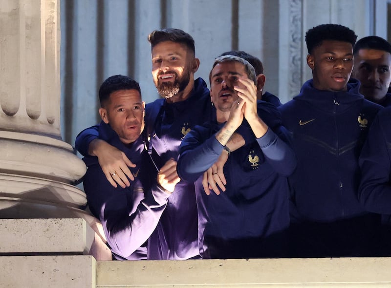 France's Olivier Giroud, Antoine Griezmann and Aurelien Tchouameni greet fans in Paris. Reuters