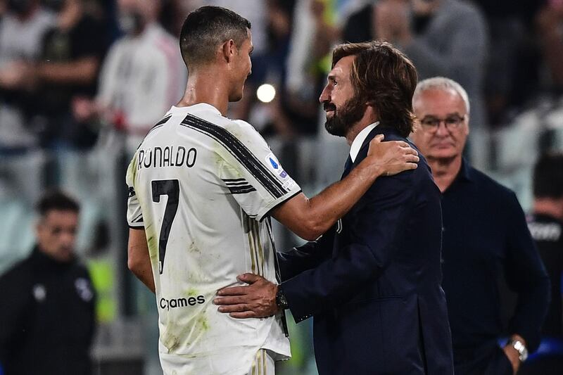 Juventus manager Andrea Pirlo congratulates Cristiano Ronaldo after beating Sampdoria 3-0 in their opening game of the Serie A season. AFP